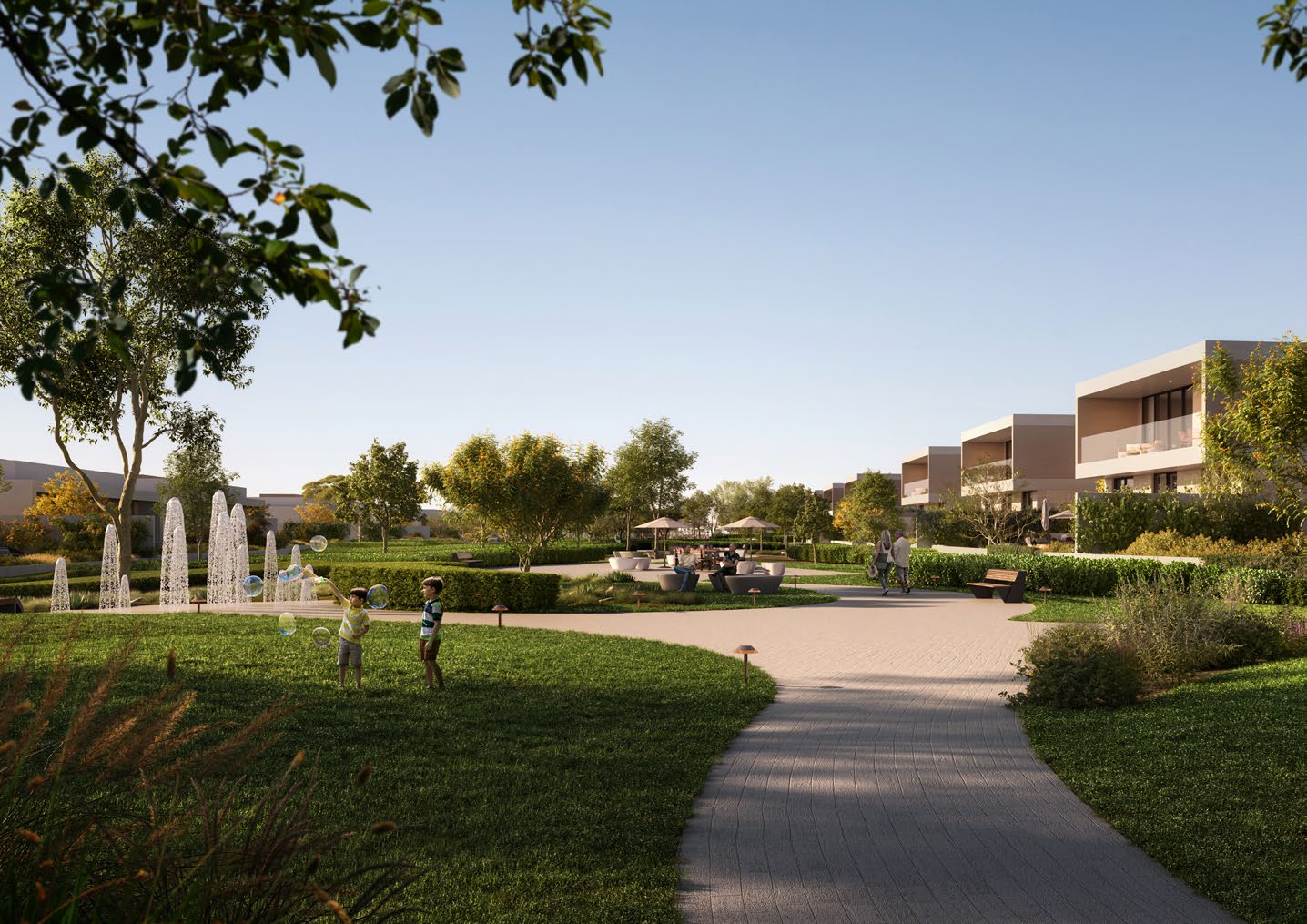 Landscaped park with fountains, lawns and a winding path