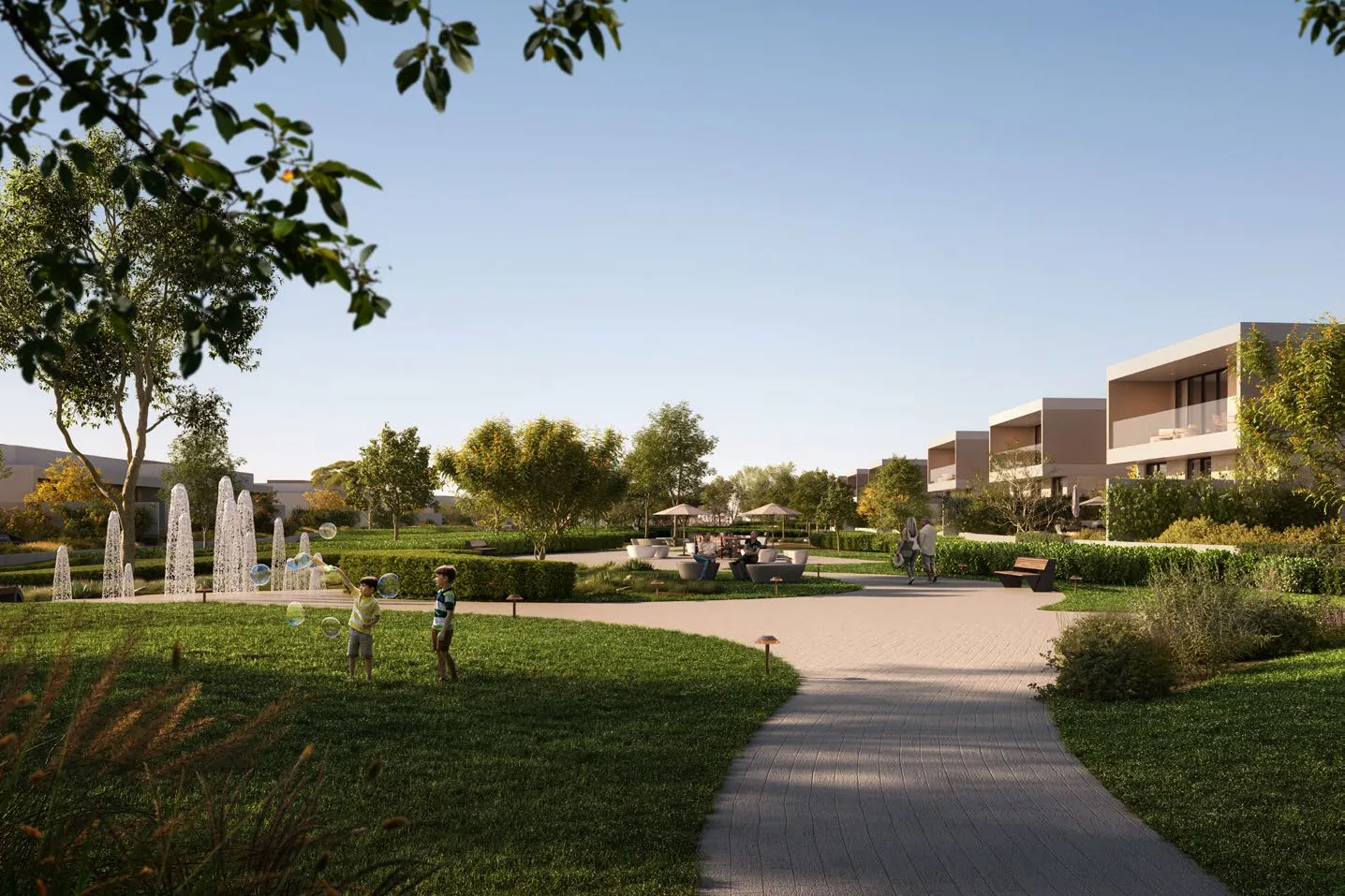 Landscaped park with fountains, lawns and a winding path