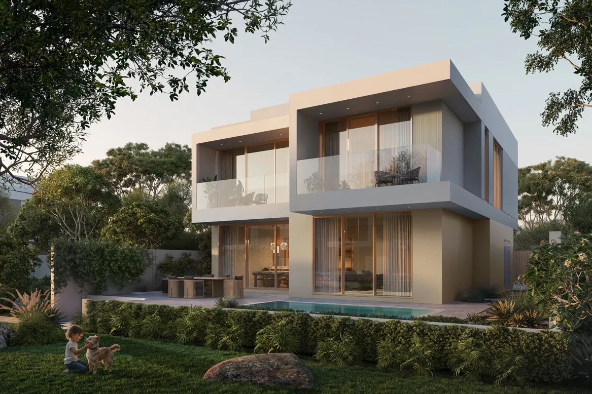 Back of a four-bedroom villa with balconies, pool and lawn
